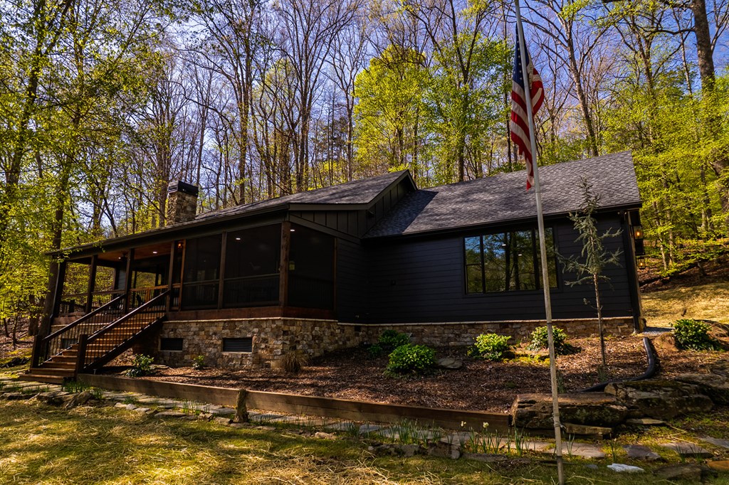 480 Riveredge Lane Ellijay, GA 30540 - Photo 11 of 66 a front view of a house with garden