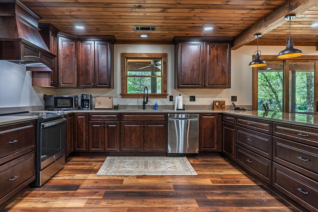 480 Riveredge Lane Ellijay, GA 30540 - Photo 20 of 66 a kitchen with a sink stove and cabinets
