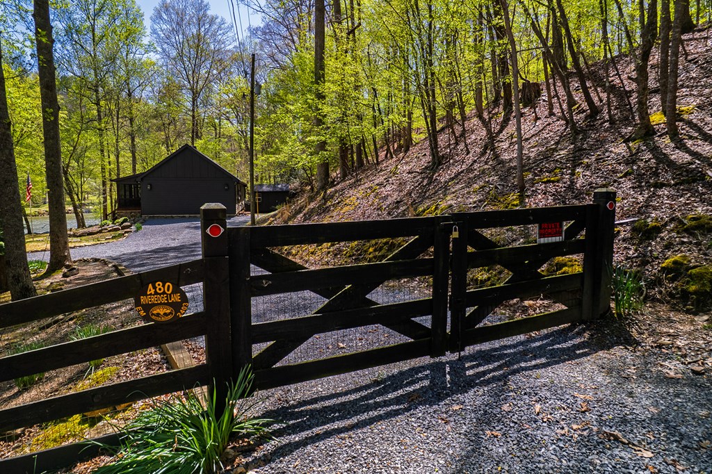 480 Riveredge Lane Ellijay, GA 30540 - Photo 2 of 66 a view of a street sign under a large tree
