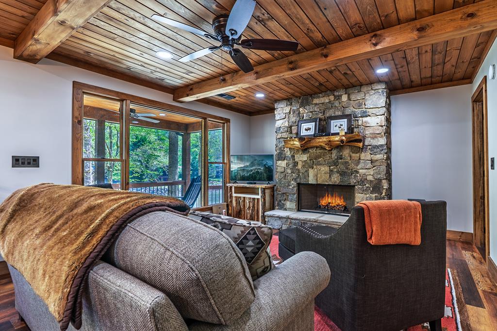 480 Riveredge Lane Ellijay, GA 30540 - Photo 22 of 66 a bed sitting in a bedroom next to a balcony