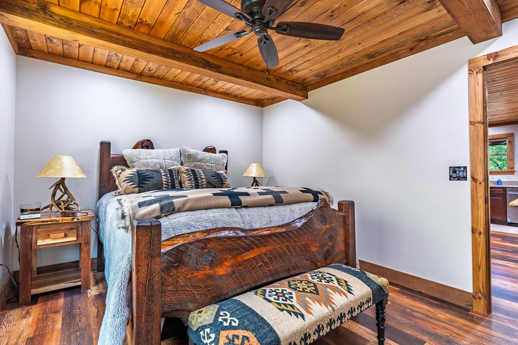 480 Riveredge Lane Ellijay, GA 30540 - Photo 26 of 66 a bed sitting in a bedroom next to a window