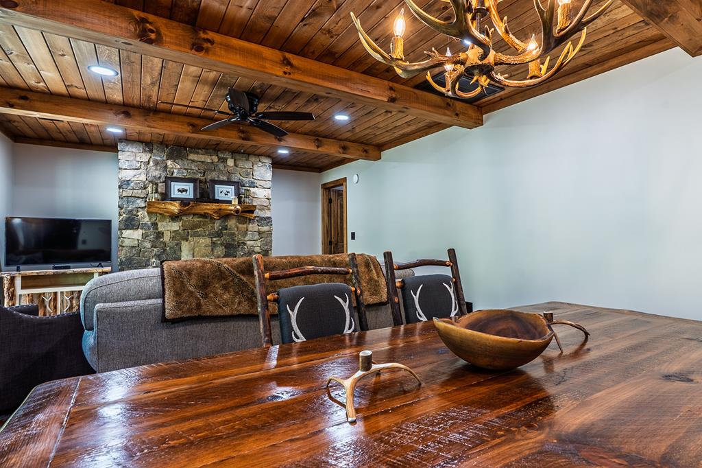 480 Riveredge Lane Ellijay, GA 30540 - Photo 27 of 66 a living room with furniture a flat screen tv and kitchen view