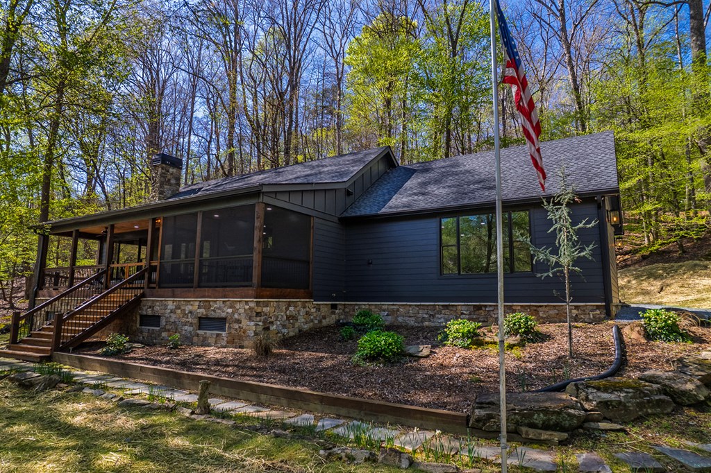 480 Riveredge Lane Ellijay, GA 30540 - Photo 3 of 66 a front view of a house with garden