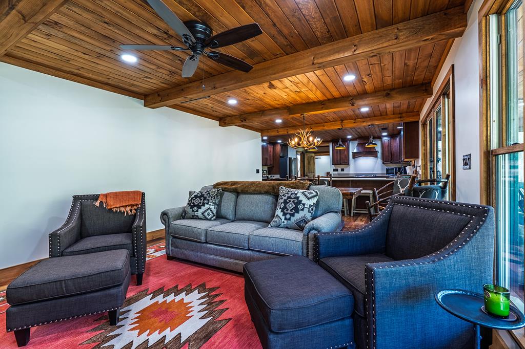 480 Riveredge Lane Ellijay, GA 30540 - Photo 31 of 66 a living room with furniture and a wooden floor