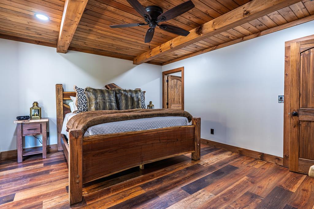 480 Riveredge Lane Ellijay, GA 30540 - Photo 32 of 66 a bedroom with a bed and wooden floor