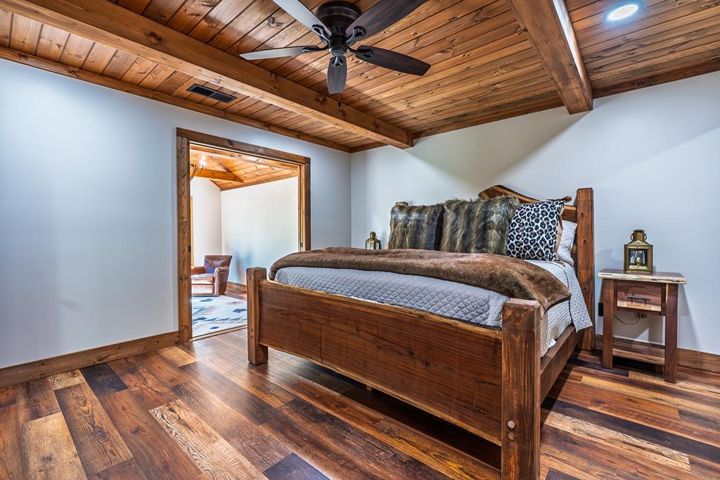 480 Riveredge Lane Ellijay, GA 30540 - Photo 34 of 66 a bed sitting in a bedroom next to a window