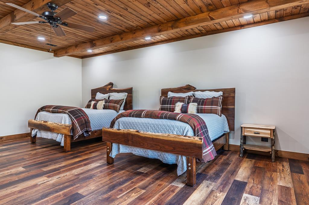 480 Riveredge Lane Ellijay, GA 30540 - Photo 38 of 66 a bedroom with two beds and a lamp