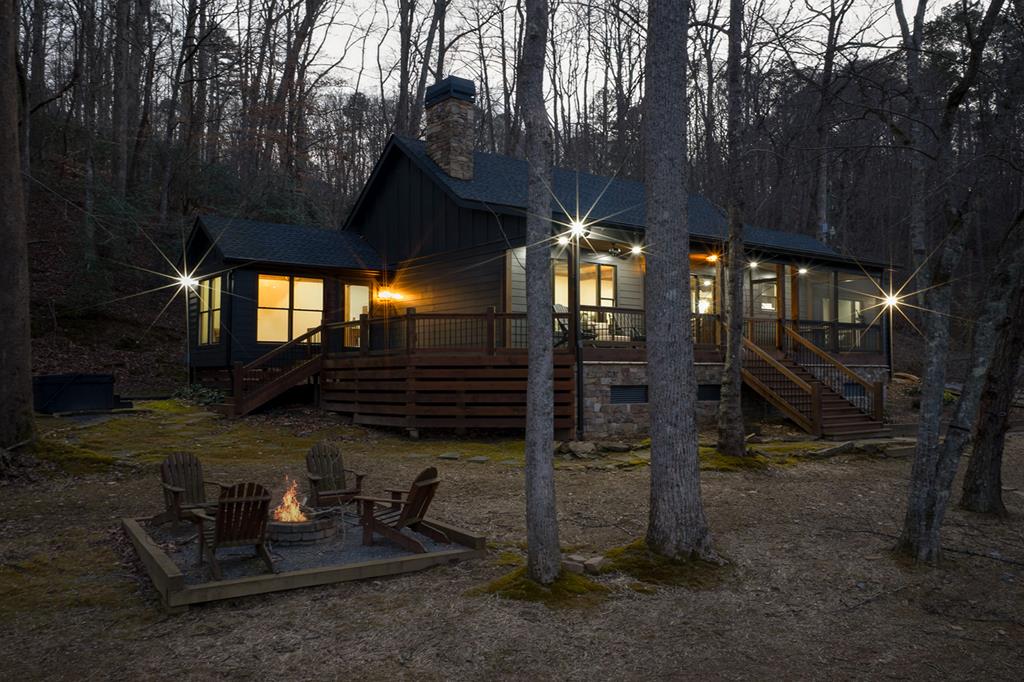 480 Riveredge Lane Ellijay, GA 30540 - Photo 56 of 66 a backyard of a house with barbeque oven table and chairs