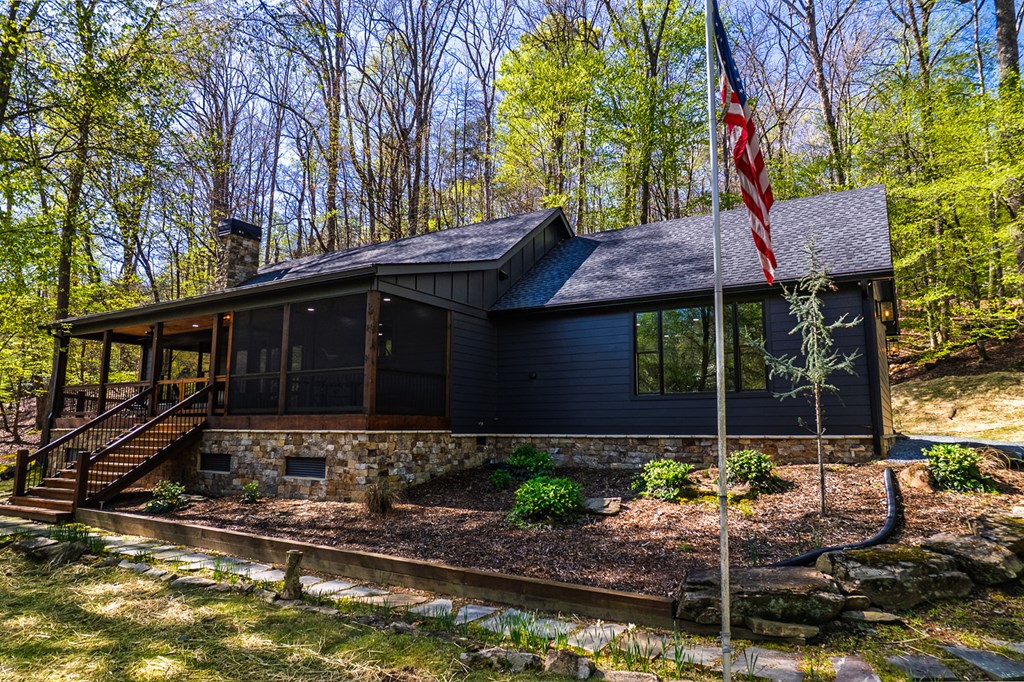 480 Riveredge Lane Ellijay, GA 30540 - Photo 8 of 66 a front view of a house with garden