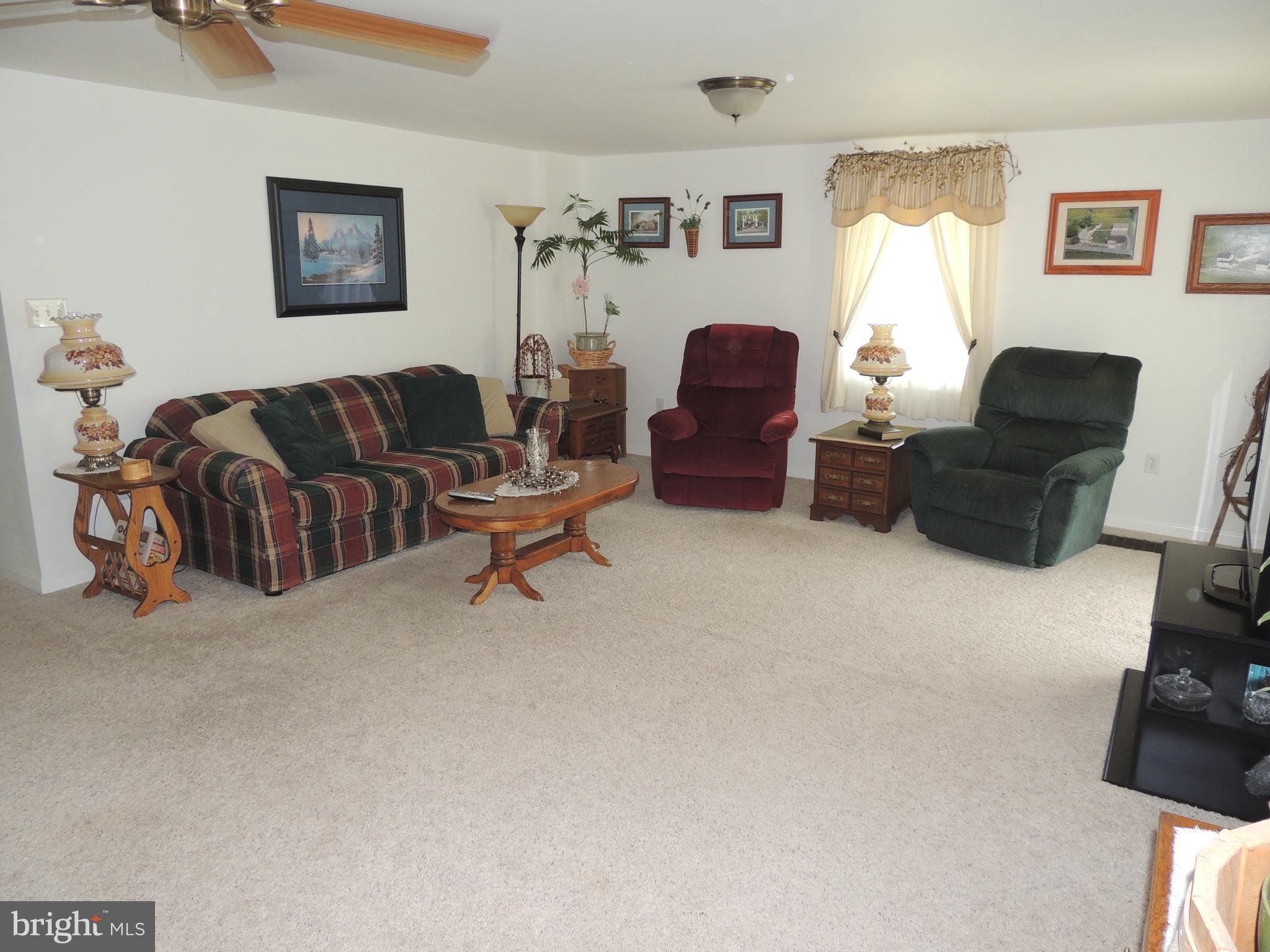 13730 Unionville Road Mount Airy, MD 21771 - Photo 2 of 30 a living room with furniture and a window