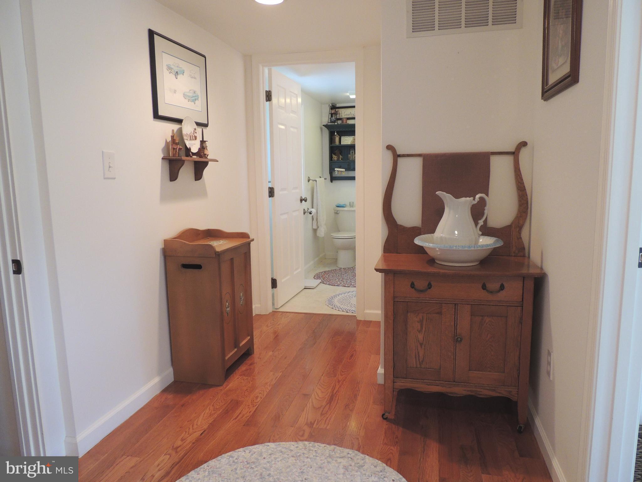 13730 Unionville Road Mount Airy, MD 21771 - Photo 11 of 30 a living room with furniture and wooden floor