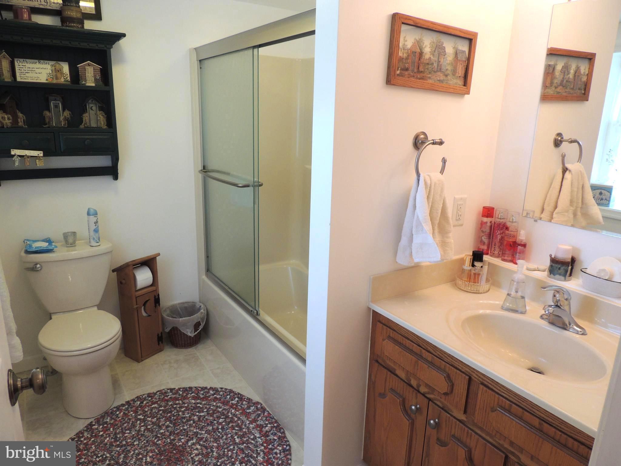 13730 Unionville Road Mount Airy, MD 21771 - Photo 12 of 30 a bathroom with a sink toilet and vanity
