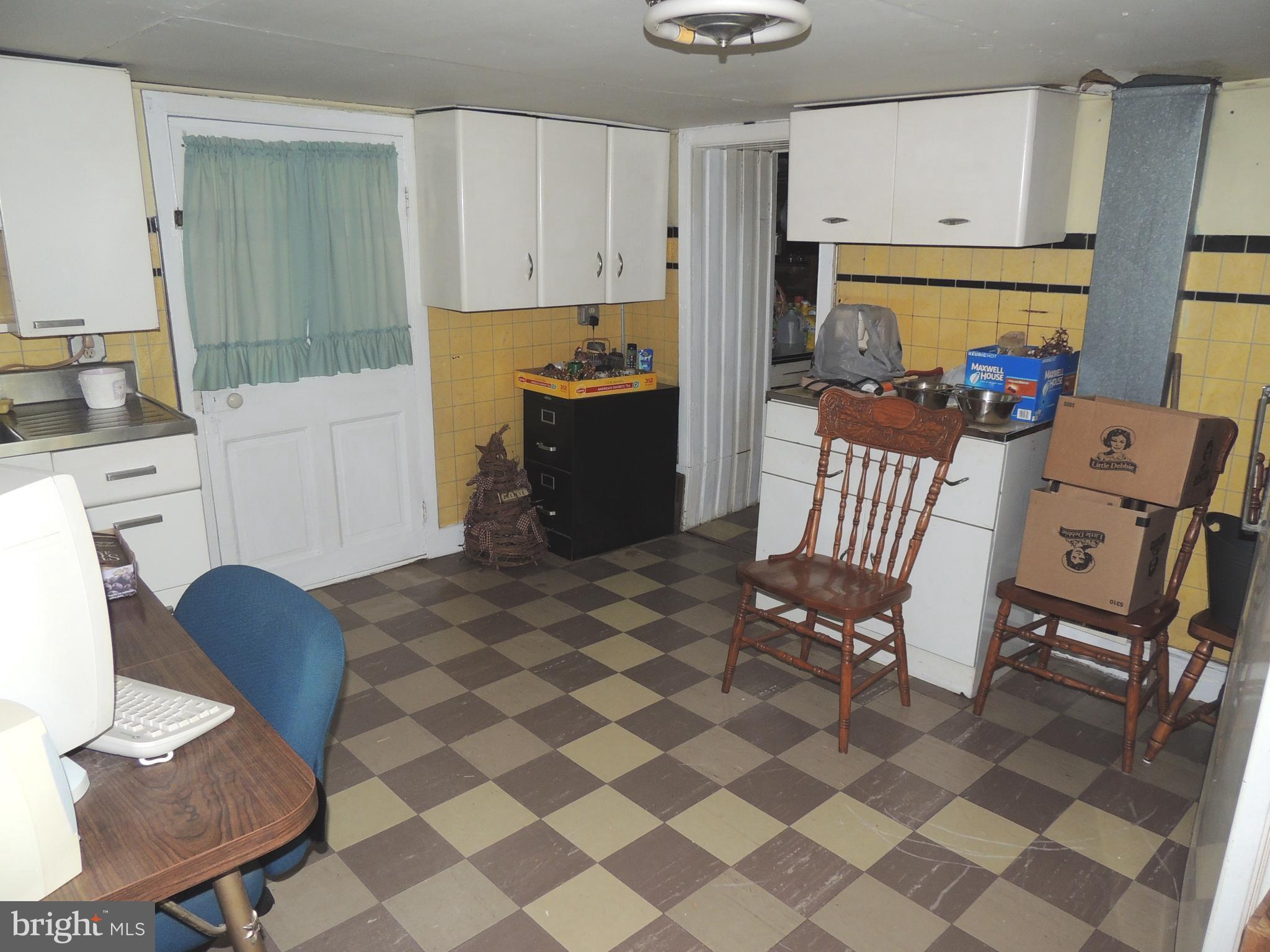 13730 Unionville Road Mount Airy, MD 21771 - Photo 14 of 30 a kitchen with stainless steel appliances a stove a refrigerator a dining table and chairs