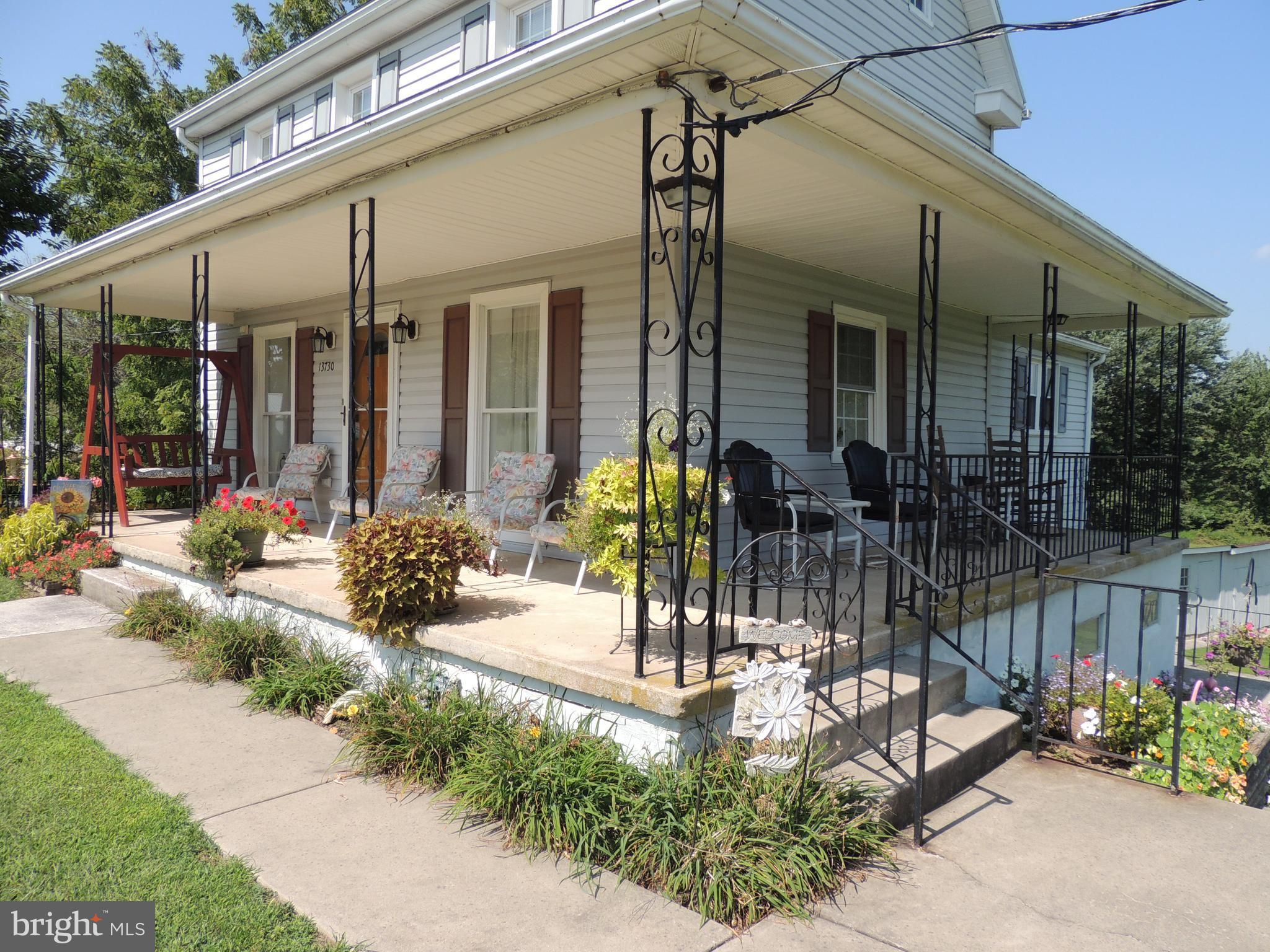 13730 Unionville Road Mount Airy, MD 21771 - Photo 18 of 30 a view of a patio with table and chairs and potted plants