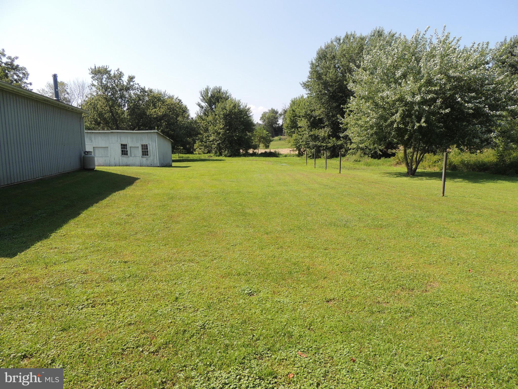 13730 Unionville Road Mount Airy, MD 21771 - Photo 29 of 30 a view of a field with trees in the background