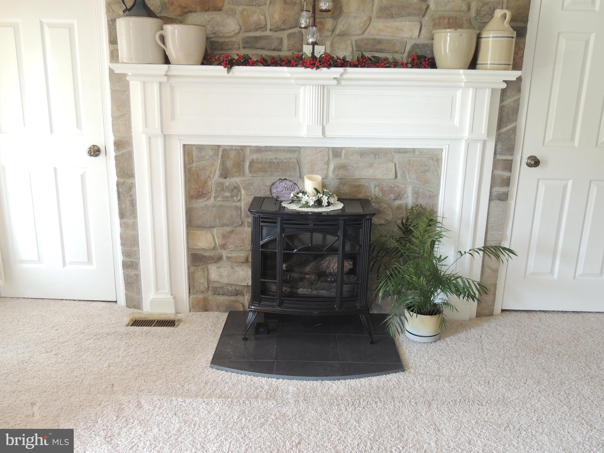 13730 Unionville Road Mount Airy, MD 21771 - Photo 4 of 30 a living room with a fireplace