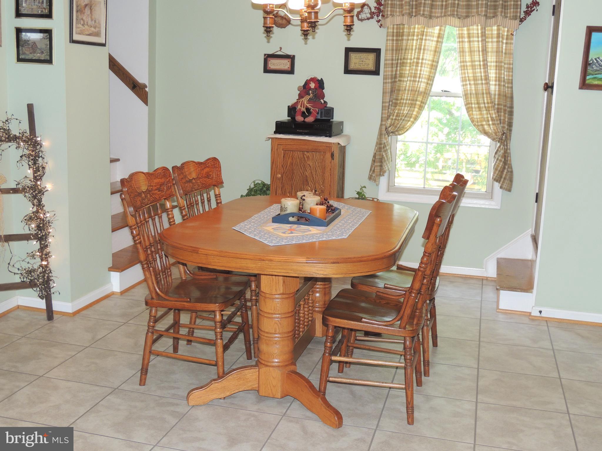 13730 Unionville Road Mount Airy, MD 21771 - Photo 5 of 30 a view of a dining room with furniture and window