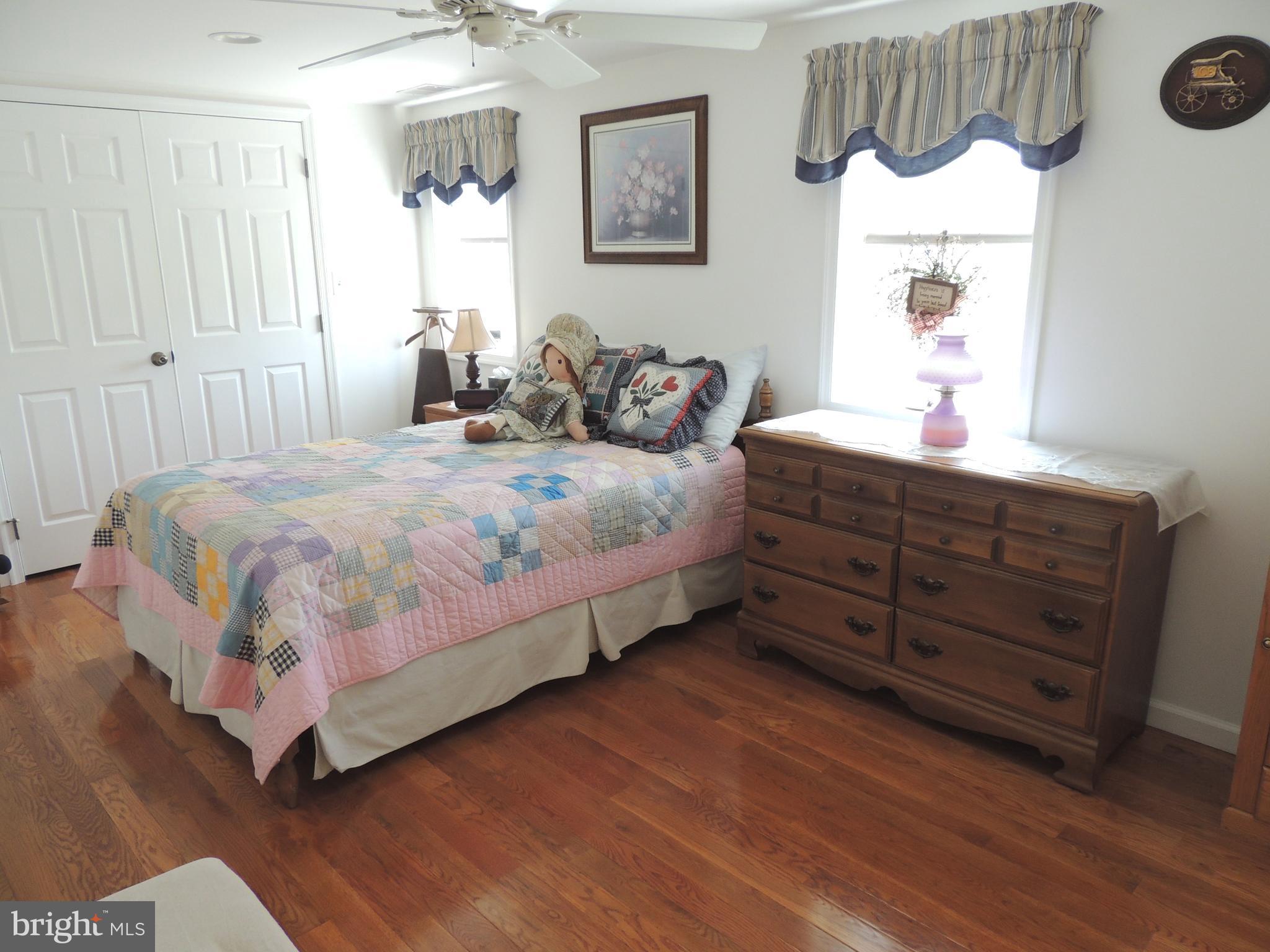 13730 Unionville Road Mount Airy, MD 21771 - Photo 9 of 30 a bedroom with a bed a dresser and a window