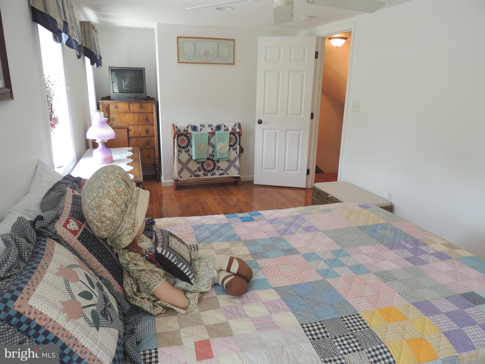 13730 Unionville Road Mount Airy, MD 21771 - Photo 10 of 30 a bedroom with a bed and window