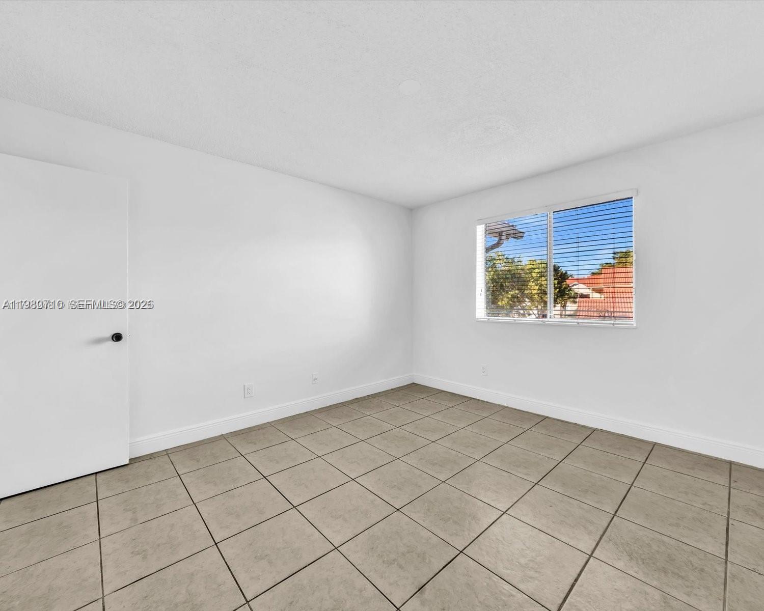 15770 Southwest 106th Terrace, Unit 303 Miami, FL 33196 - Photo 33 of 64 a view of an empty room