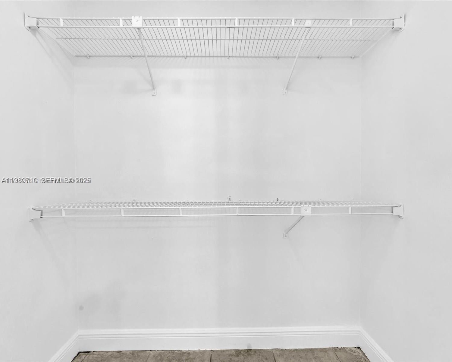 15770 Southwest 106th Terrace, Unit 303 Miami, FL 33196 - Photo 38 of 64 a view of a room with racks on the wall