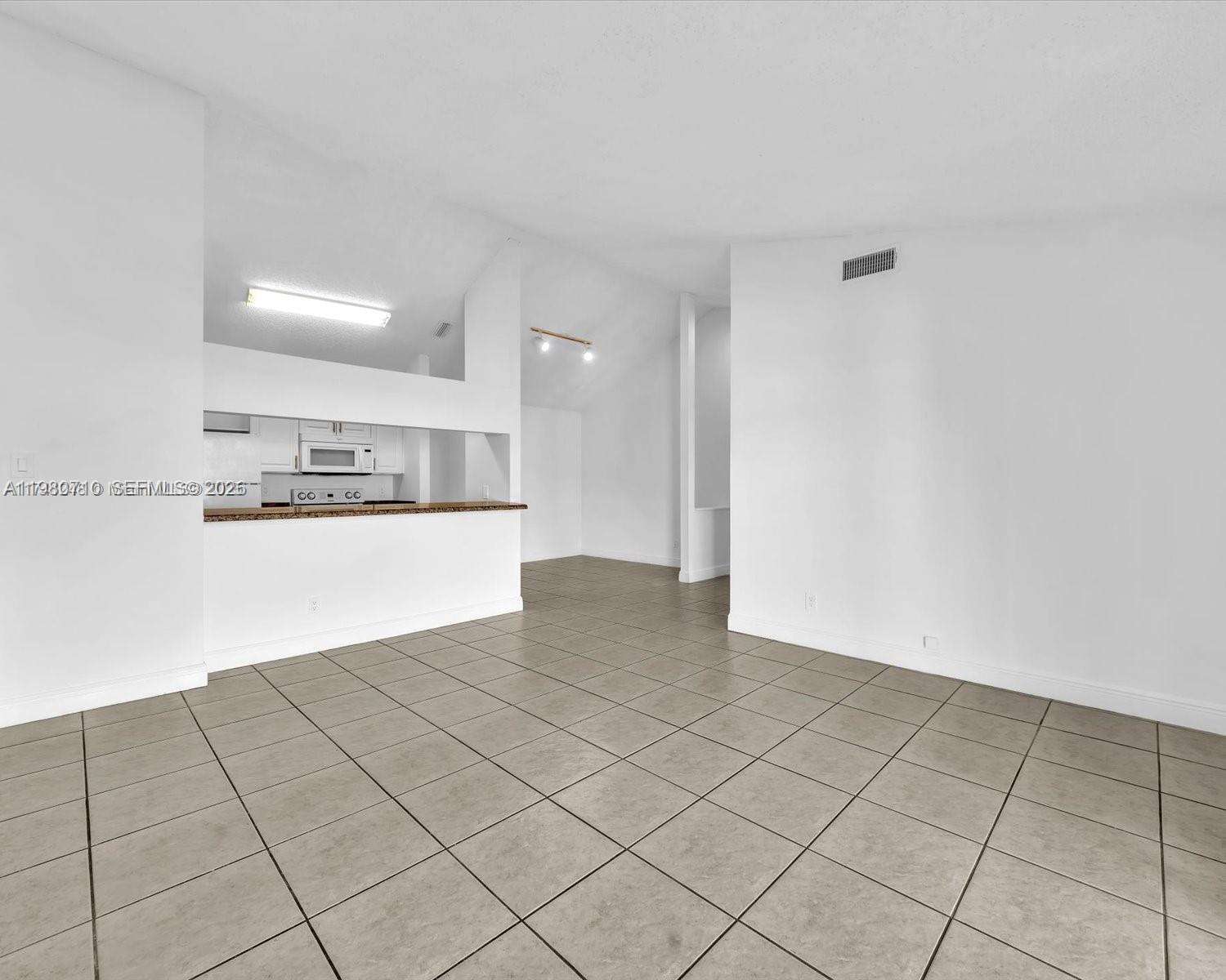 15770 Southwest 106th Terrace, Unit 303 Miami, FL 33196 - Photo 47 of 64 a view of kitchen with cabinet