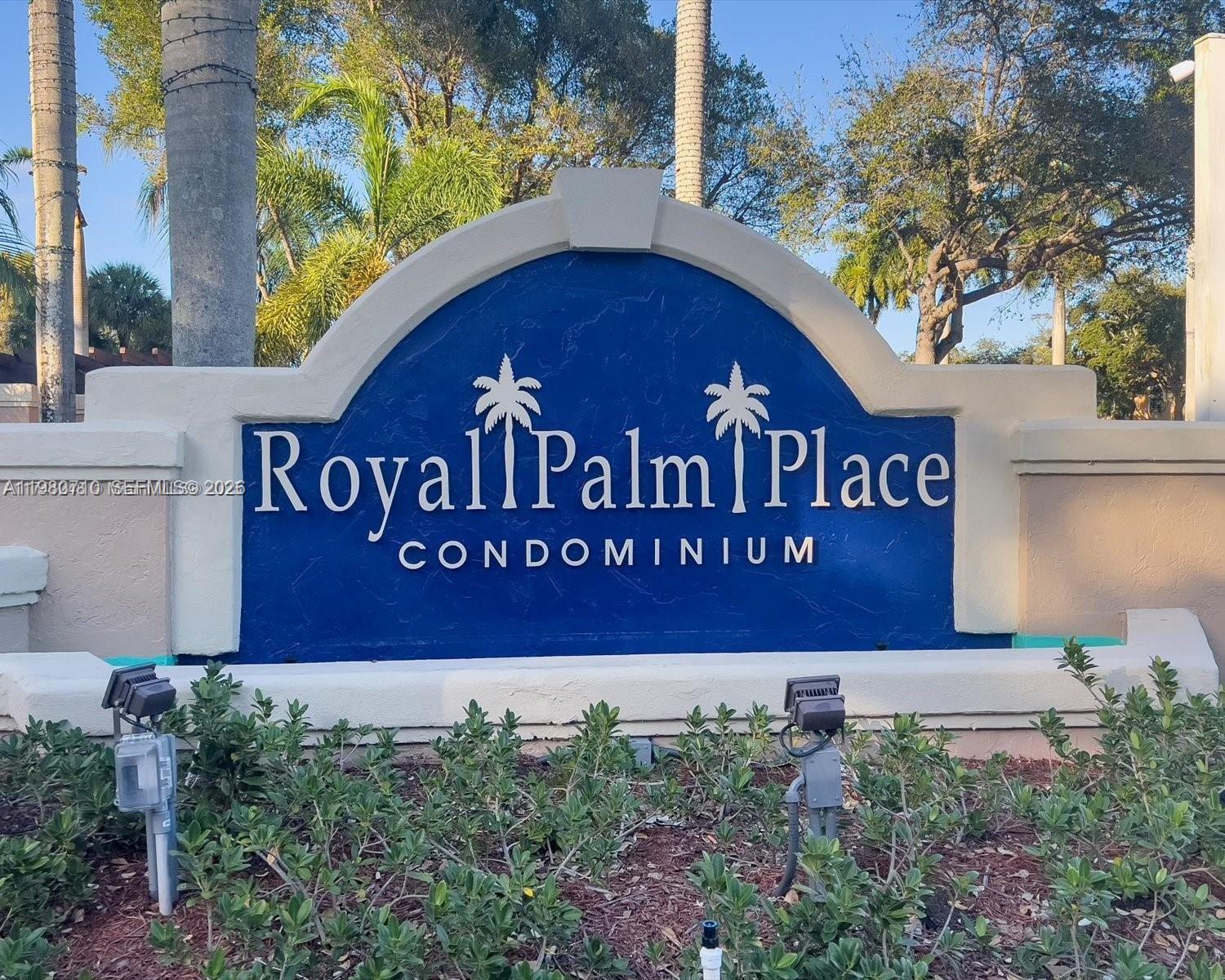 15770 Southwest 106th Terrace, Unit 303 Miami, FL 33196 - Photo 48 of 64 a sign that is sitting on a brick wall