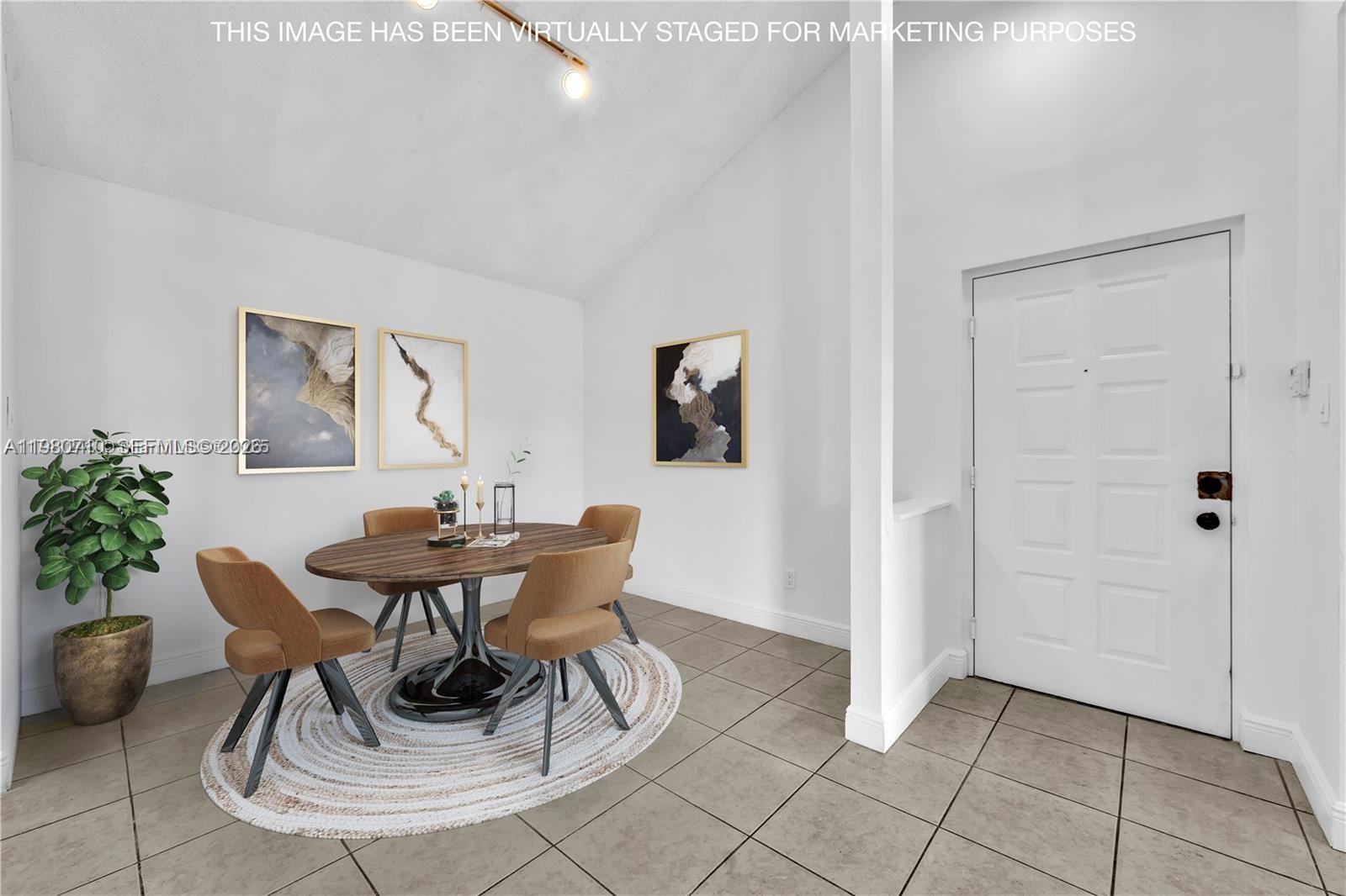 15770 Southwest 106th Terrace, Unit 303 Miami, FL 33196 - Photo 5 of 64 a view of a dining room with furniture