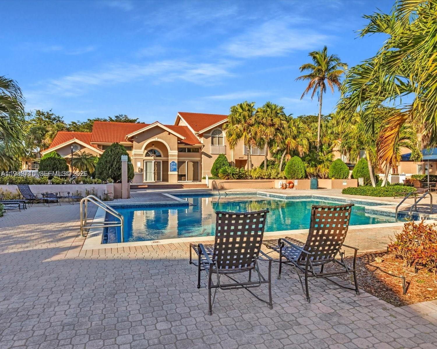 15770 Southwest 106th Terrace, Unit 303 Miami, FL 33196 - Photo 51 of 64 a view of a chairs and table in the patio