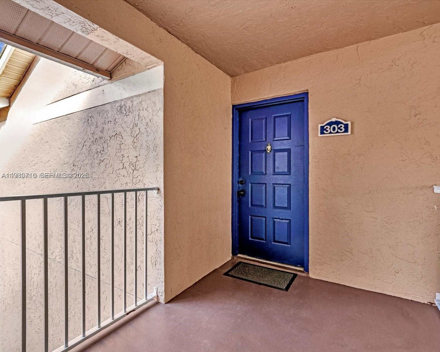 15770 Southwest 106th Terrace, Unit 303 Miami, FL 33196 - Photo 58 of 64 a view of an empty room and wooden floor