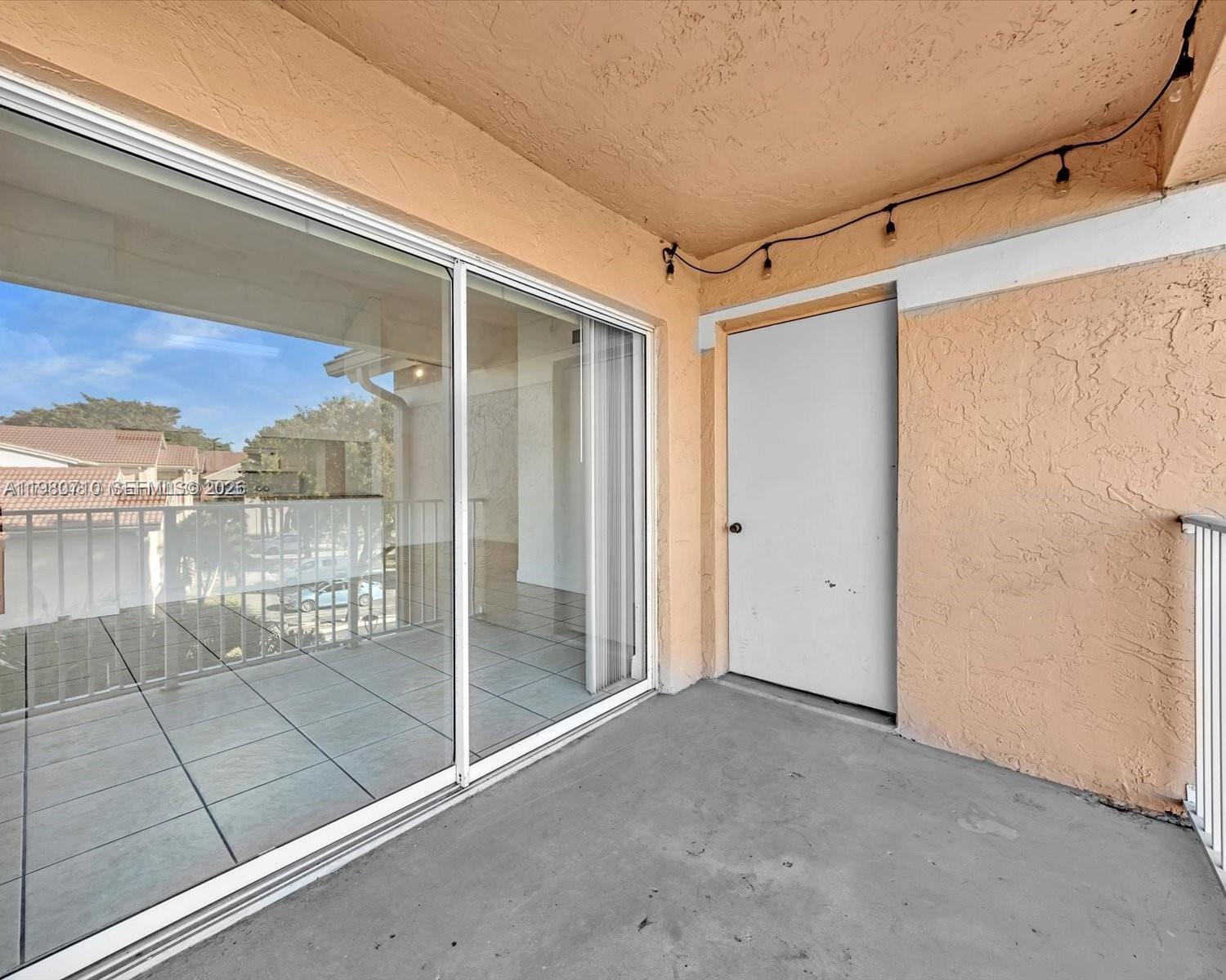 15770 Southwest 106th Terrace, Unit 303 Miami, FL 33196 - Photo 59 of 64 a view of a bathroom with a glass door