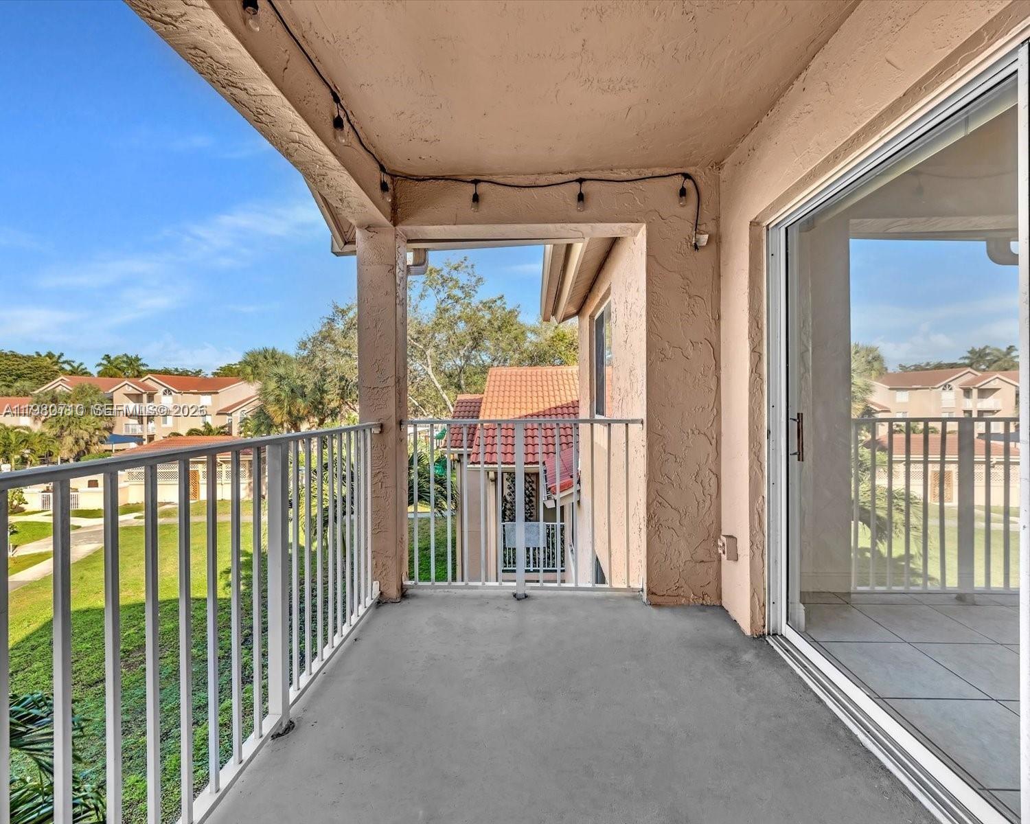 15770 Southwest 106th Terrace, Unit 303 Miami, FL 33196 - Photo 61 of 64 a view of porch with a glass door