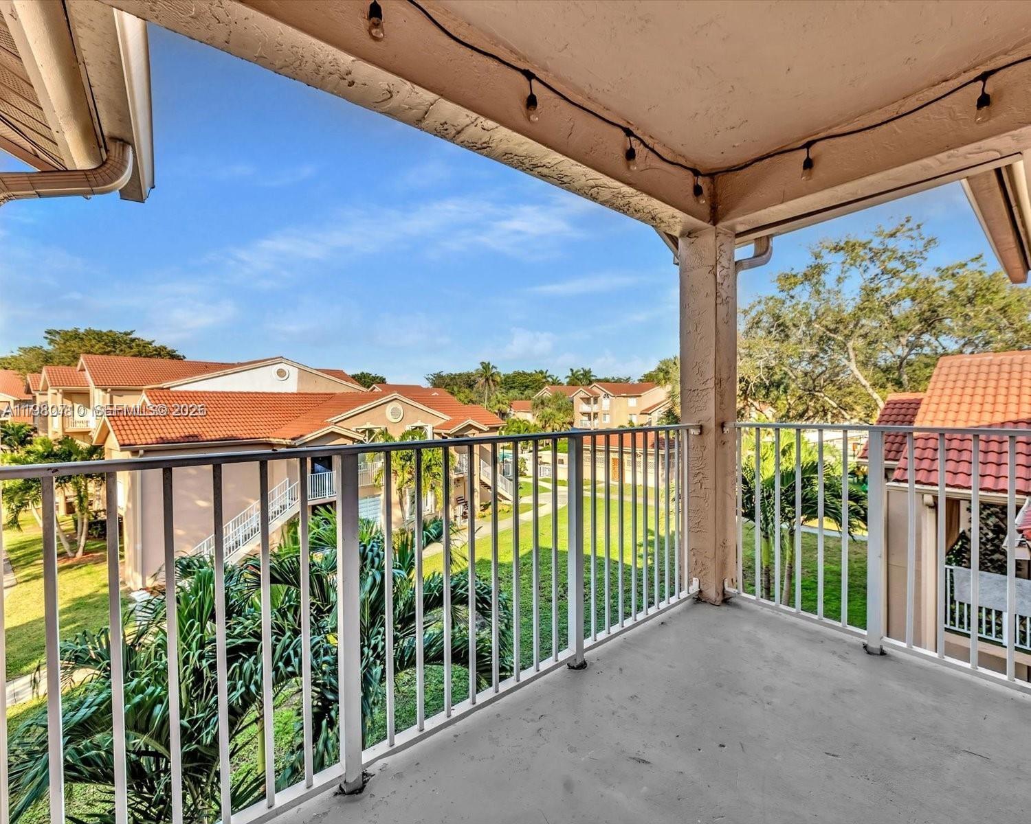 15770 Southwest 106th Terrace, Unit 303 Miami, FL 33196 - Photo 62 of 64 a view of a street from a balcony