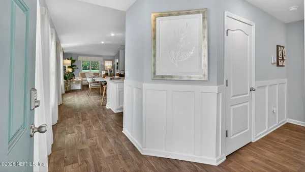 a bedroom with a bed and a table in it