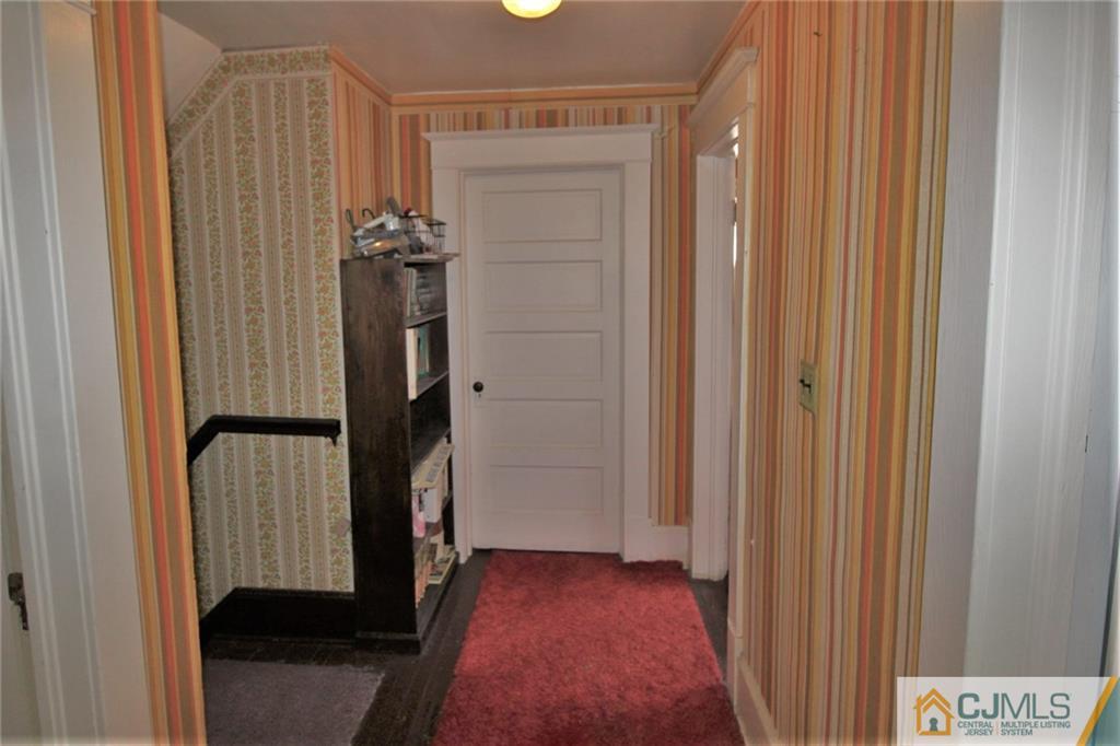 582 Ridge Road Monmouth Junction, NJ 08852 - Photo 14 of 18 a view of hallway with stairs