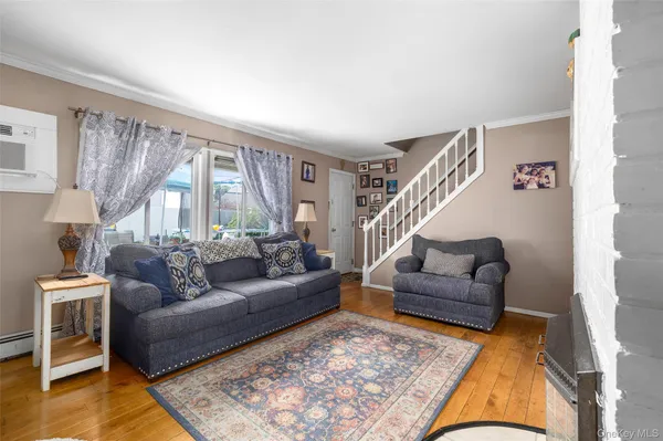 a living room with furniture and a rug