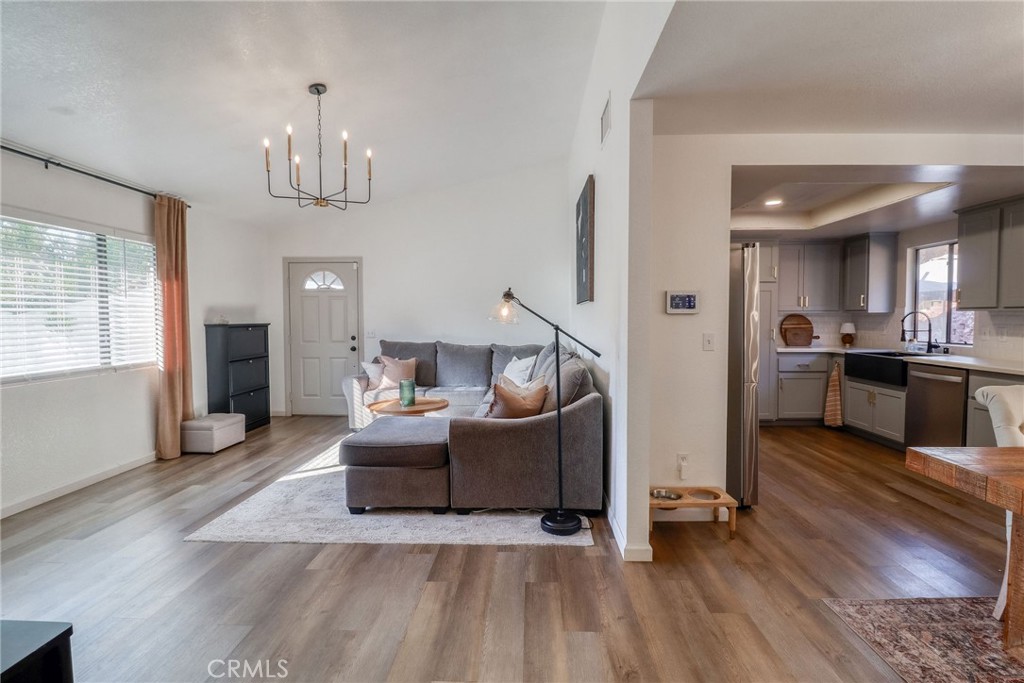 14235 Judy Ann Drive Riverside, CA 92503 - Photo 11 of 68 a living room with furniture and a chandelier