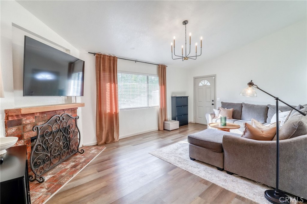 14235 Judy Ann Drive Riverside, CA 92503 - Photo 12 of 68 a living room with furniture and a flat screen tv