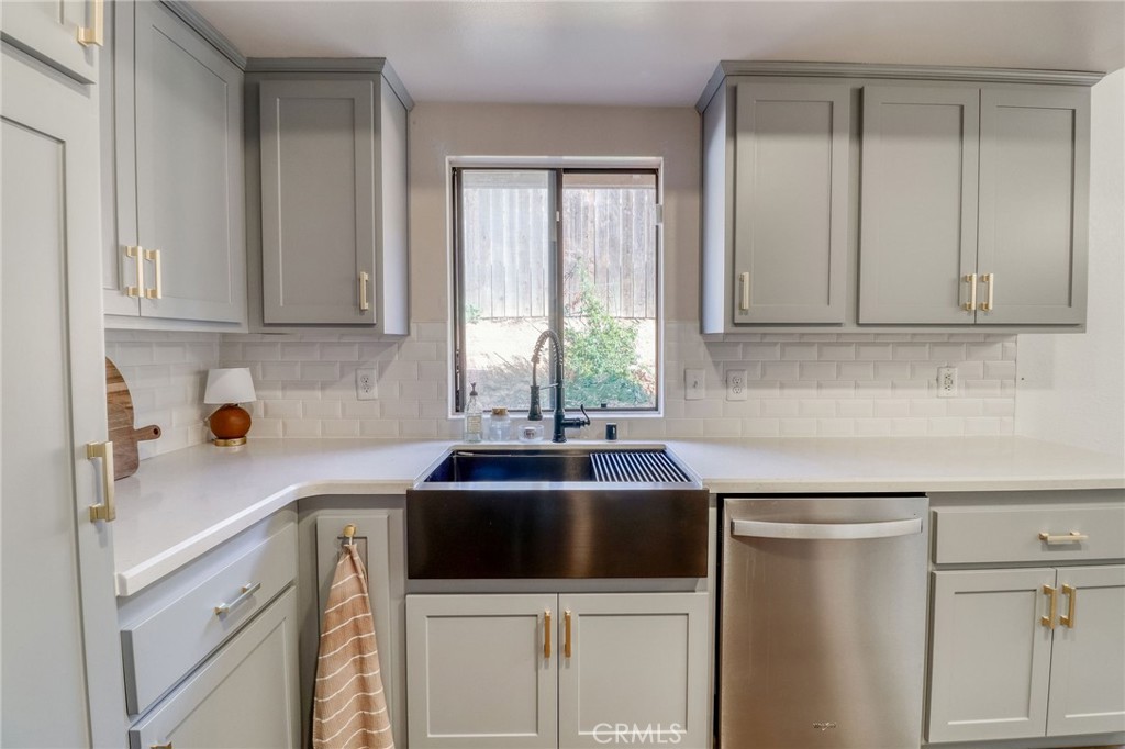 14235 Judy Ann Drive Riverside, CA 92503 - Photo 17 of 68 a kitchen with a sink cabinets and window
