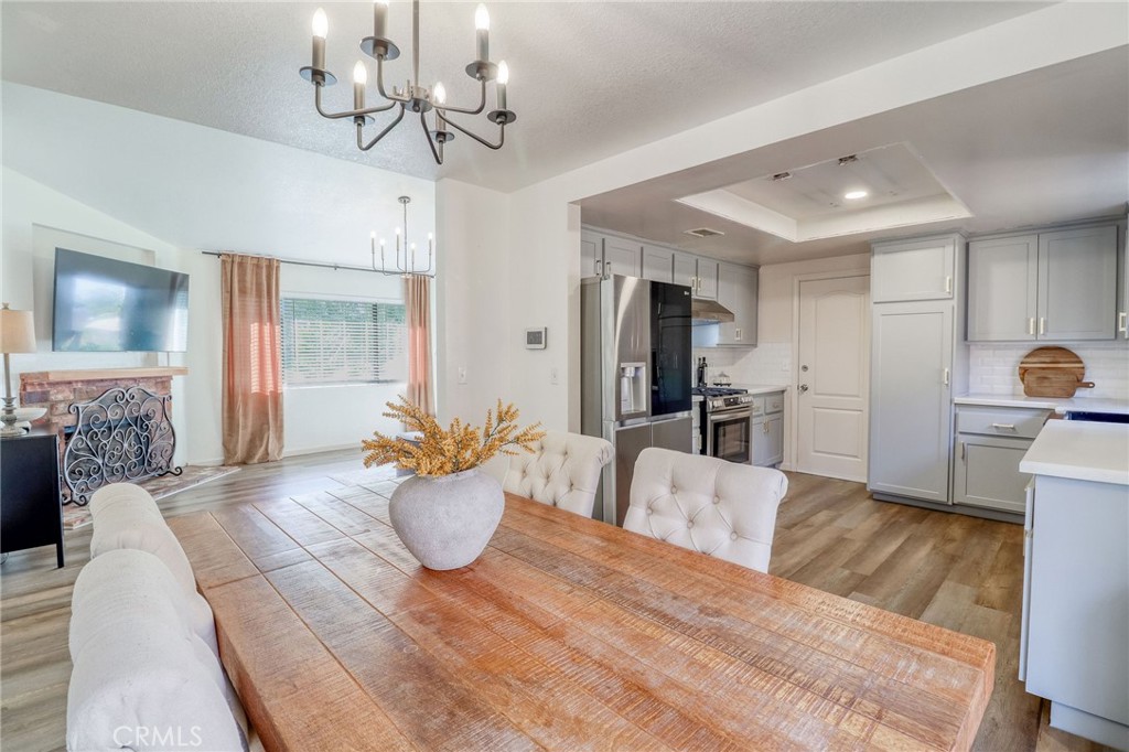 14235 Judy Ann Drive Riverside, CA 92503 - Photo 19 of 68 a living room with furniture and a chandelier