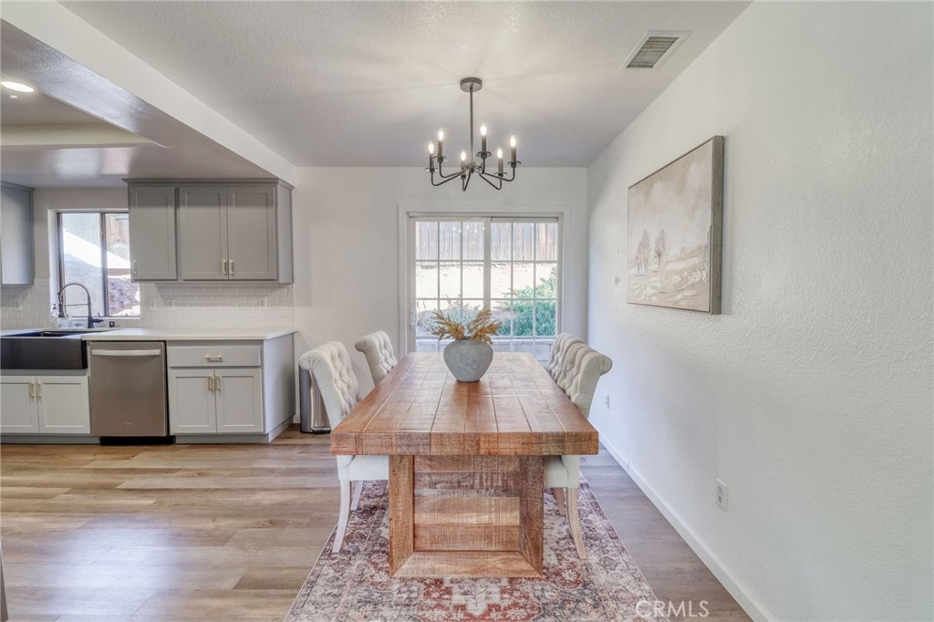 14235 Judy Ann Drive Riverside, CA 92503 - Photo 23 of 68 a view of a dining room with furniture and window