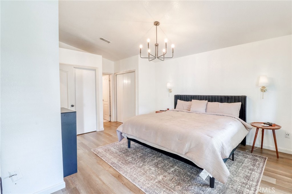 14235 Judy Ann Drive Riverside, CA 92503 - Photo 28 of 68 a bedroom with a bed and a table