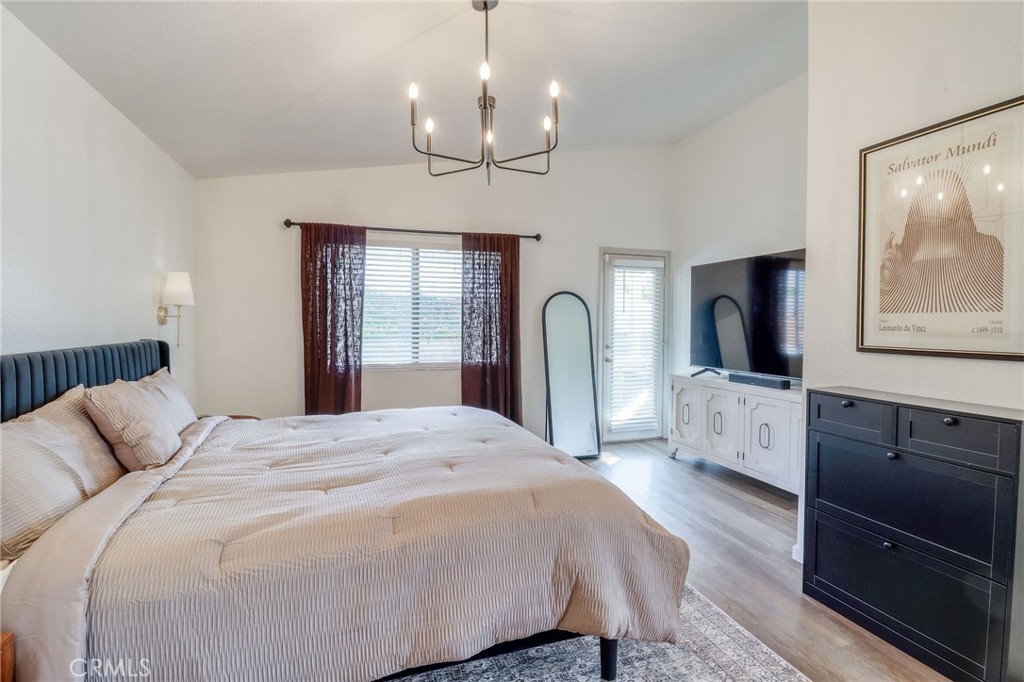 14235 Judy Ann Drive Riverside, CA 92503 - Photo 32 of 68 a spacious bedroom with a bed and dresser