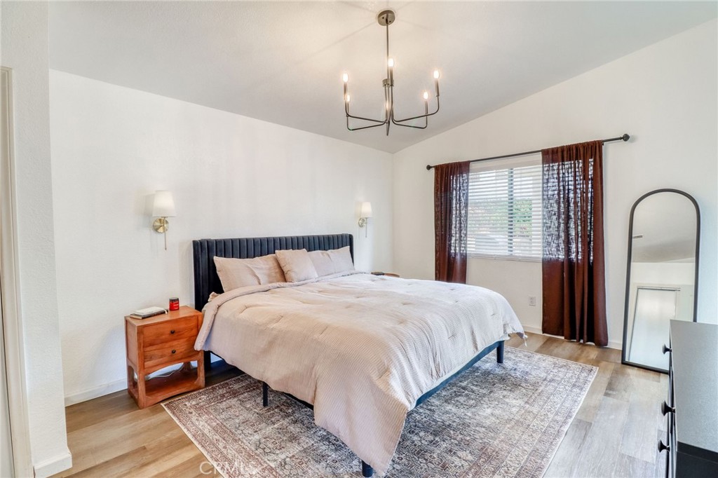 14235 Judy Ann Drive Riverside, CA 92503 - Photo 33 of 68 a spacious bedroom with bed and window