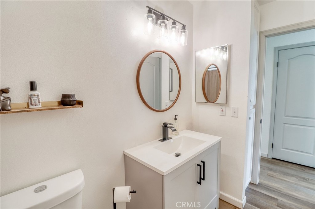 14235 Judy Ann Drive Riverside, CA 92503 - Photo 39 of 68 a bathroom with a sink and a mirror
