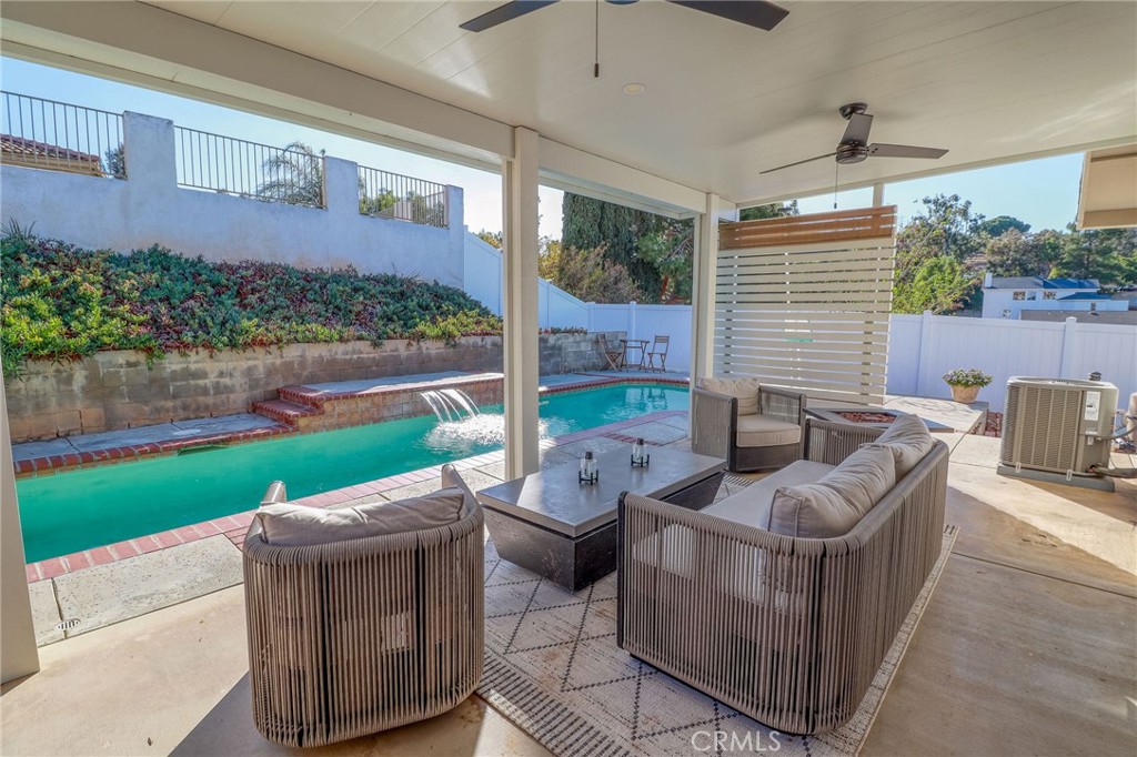 14235 Judy Ann Drive Riverside, CA 92503 - Photo 50 of 68 a view of a patio with couches chairs and a yard