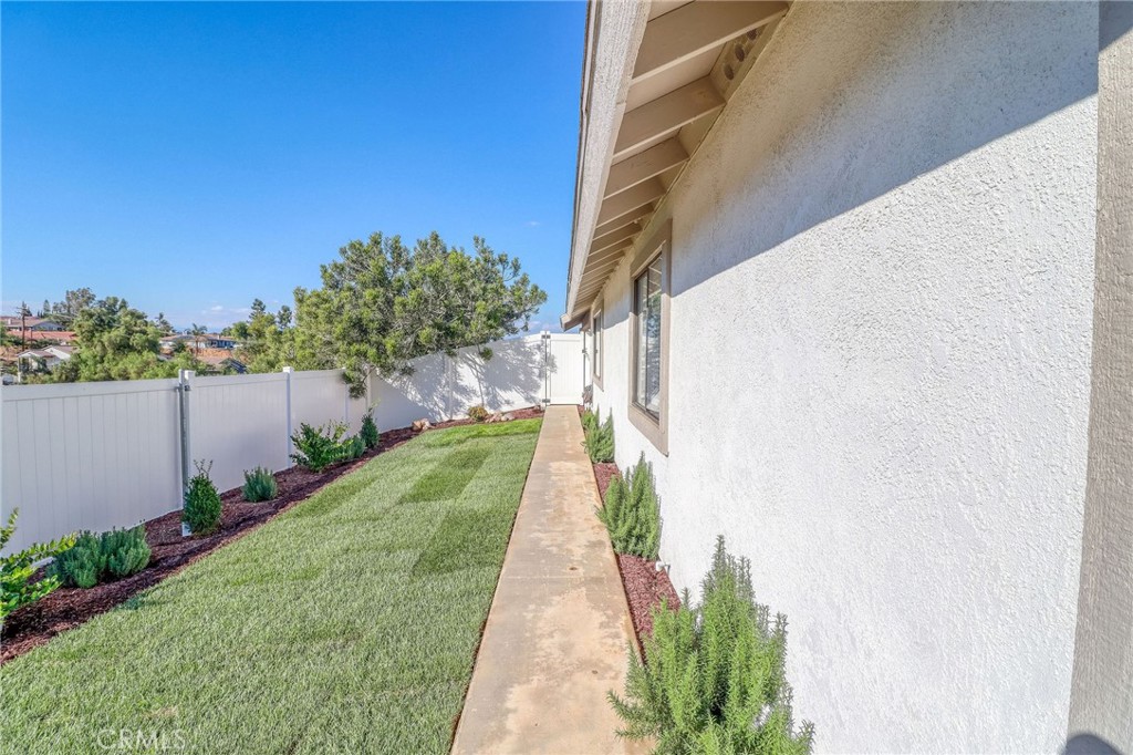 14235 Judy Ann Drive Riverside, CA 92503 - Photo 56 of 68 a view of a pathway with a white house