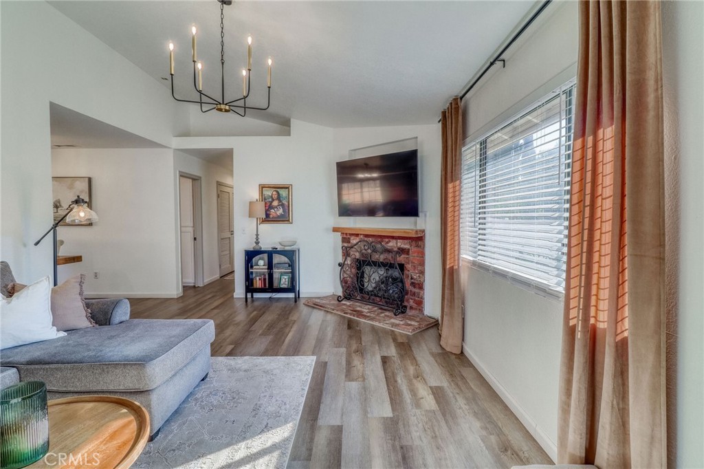 14235 Judy Ann Drive Riverside, CA 92503 - Photo 7 of 68 a living room with furniture and a fireplace