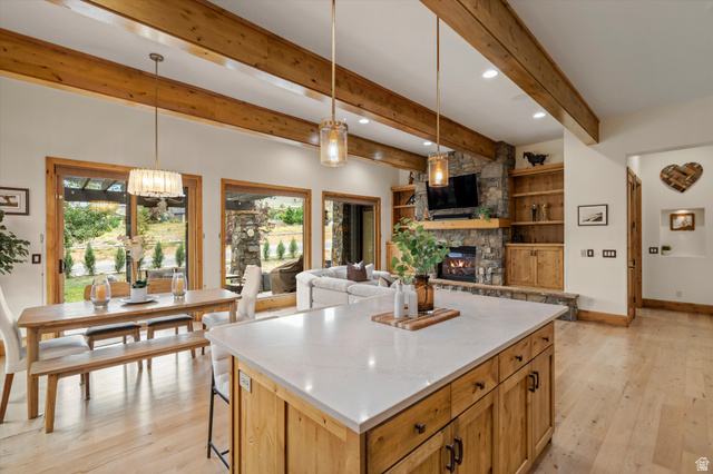 4892 Eagle Rdg Drive Eden, UT 84310 - Photo 8 of 39 Spacious open-concept interior featuring light wood-finish flooring and exposed ceiling beams