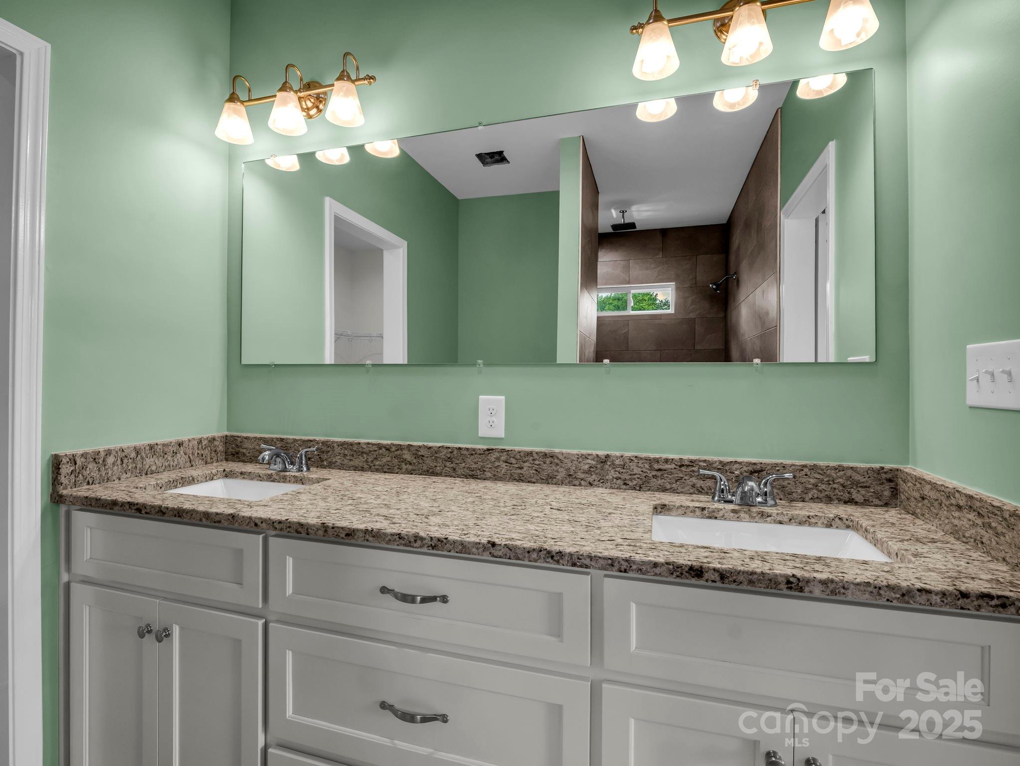 174 Charlie Randall Road Lawndale, NC 28090 - Photo 23 of 41 a bathroom with a sink and a mirror